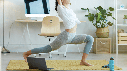 woman doing fat burning yoga workout at home featured