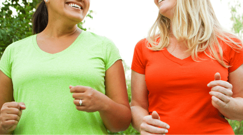 two women working out together featured