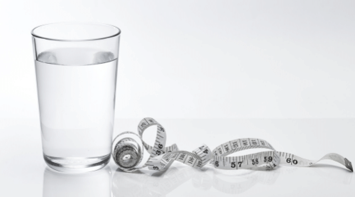 glass of water and measuring tape featured