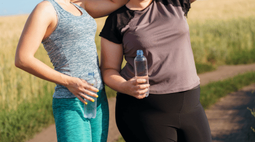 fit and overweight women working out outside featured