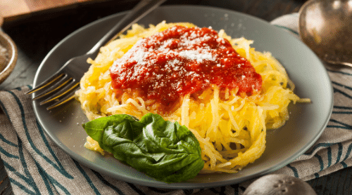 spaghetti squash in bowl with tomato sauce featured