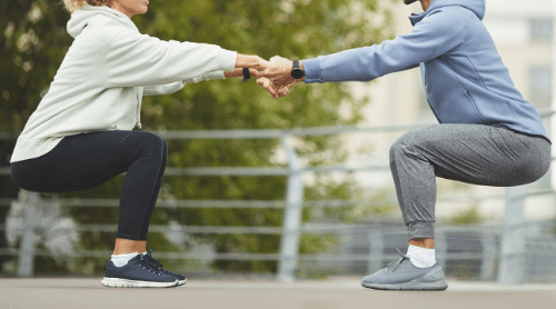 man and woman couple exercising together featured